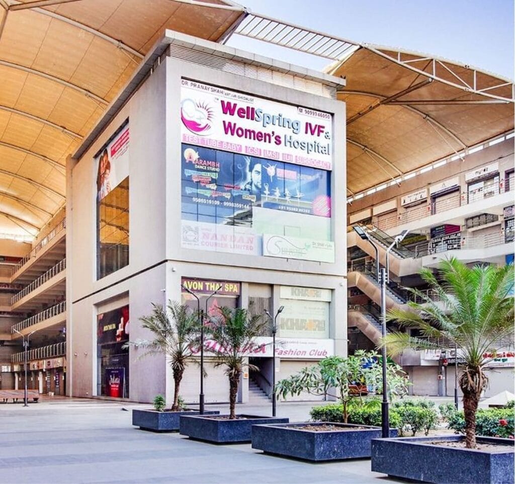 Front exterior view of Wellspring IVF & Women’s Hospital located at Titanium City Center Mall in Satellite, Ahmedabad, Gujarat
